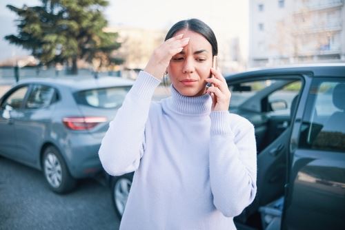 woman on the phone after a car accident in Atlanta